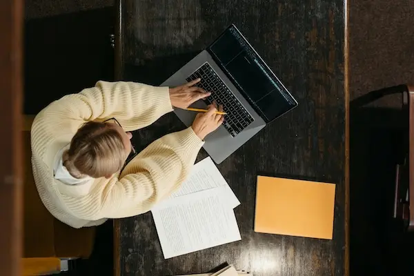 Overhead shot of a woman working at a laptop
