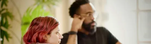 Two people engaging in a meeting