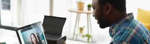 Man speaking to a woman via a video conference